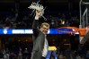 Connecticut Huskies head coach Geno Auriemma holds up a net from one of the basketball goals after winning the 2015 NCAA Women's Division I Championship game at Amalie Arena.