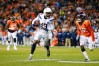 Keenan Allen runs with the ball in his hands against the Broncos