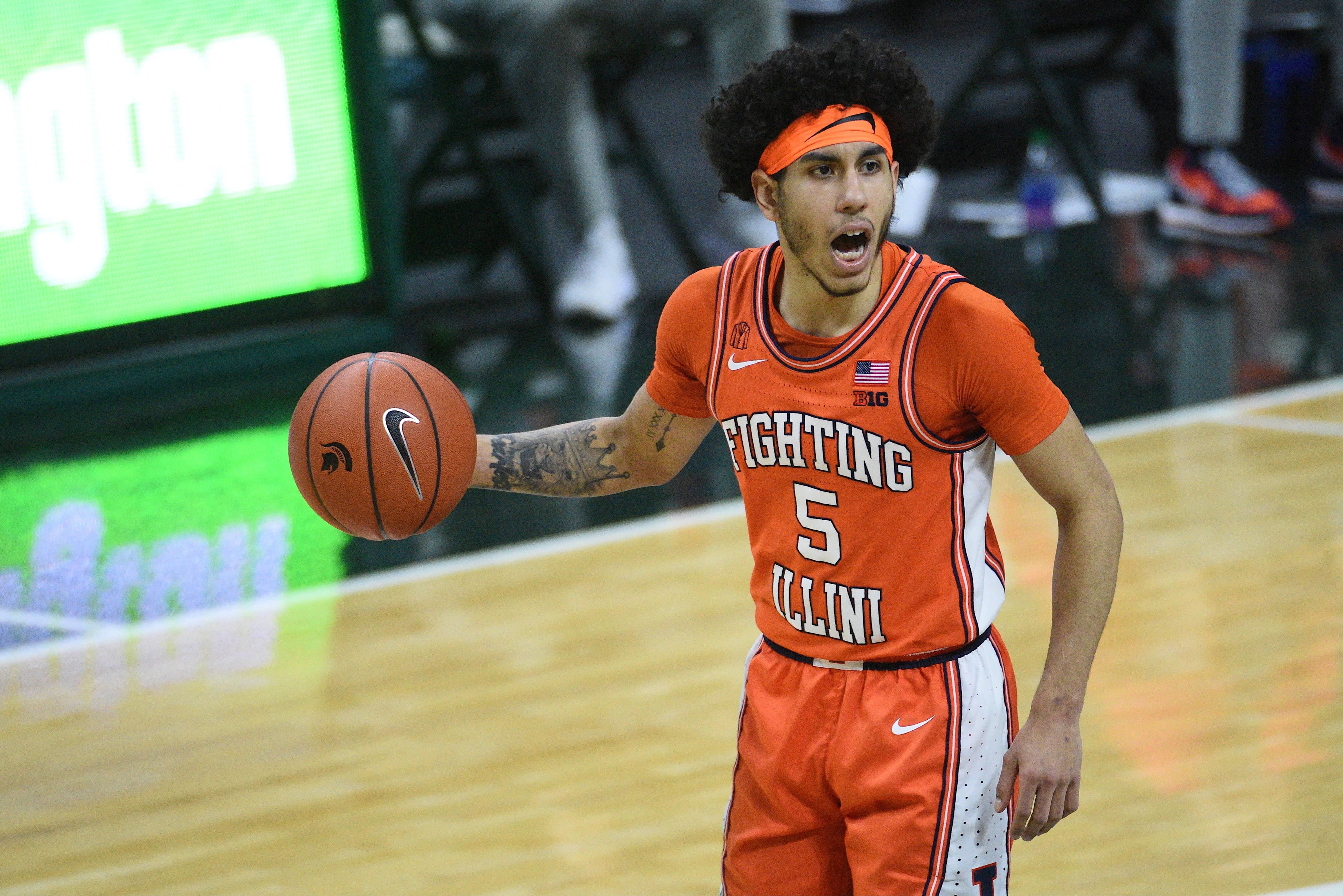 Feb 23, 2021; East Lansing, Michigan, USA; Illinois Fighting Illini guard Andre Curbelo (5) brings the ball up court against the Michigan State Spartans during the first half at Jack Breslin Student Events Center. 