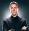 Geoff Keighley with arms folded looking at the camera