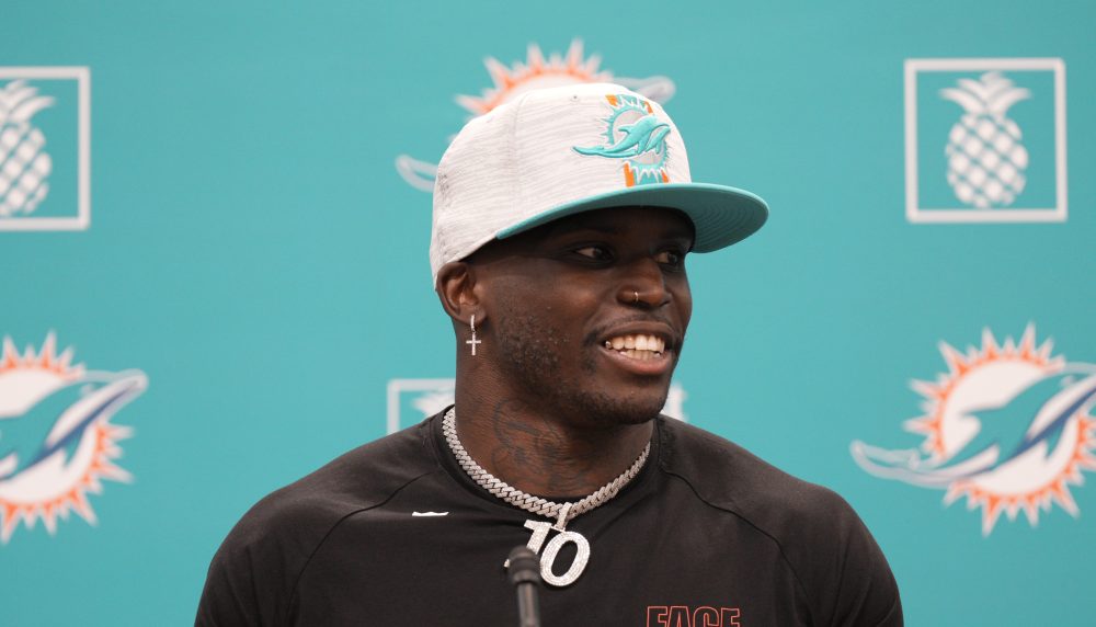 Tyreek Hill smiles during a 2022 press conference with the Dolphins
