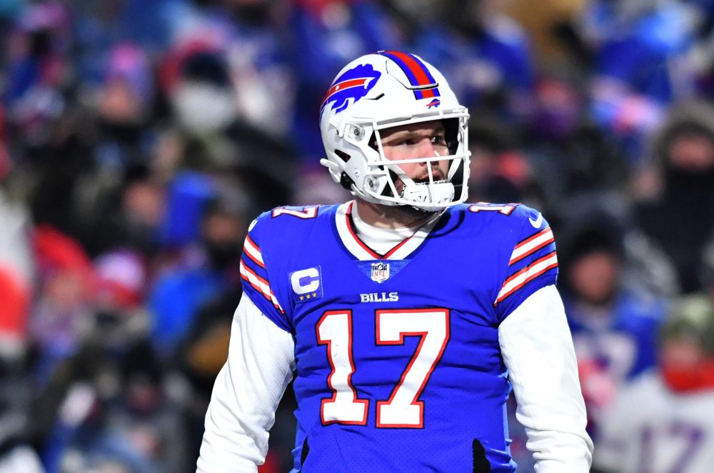 Jan 15, 2022; Orchard Park, New York, USA; Buffalo Bills quarterback Josh Allen (17) celebrates with teammates after a touchdown in the third quarter of the AFC Wild Card playoff football game against the New England Patriots at Highmark Stadium. The Bills won the game 47-17.