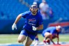 Dawson Knox runs through an on-field drill at training camp.