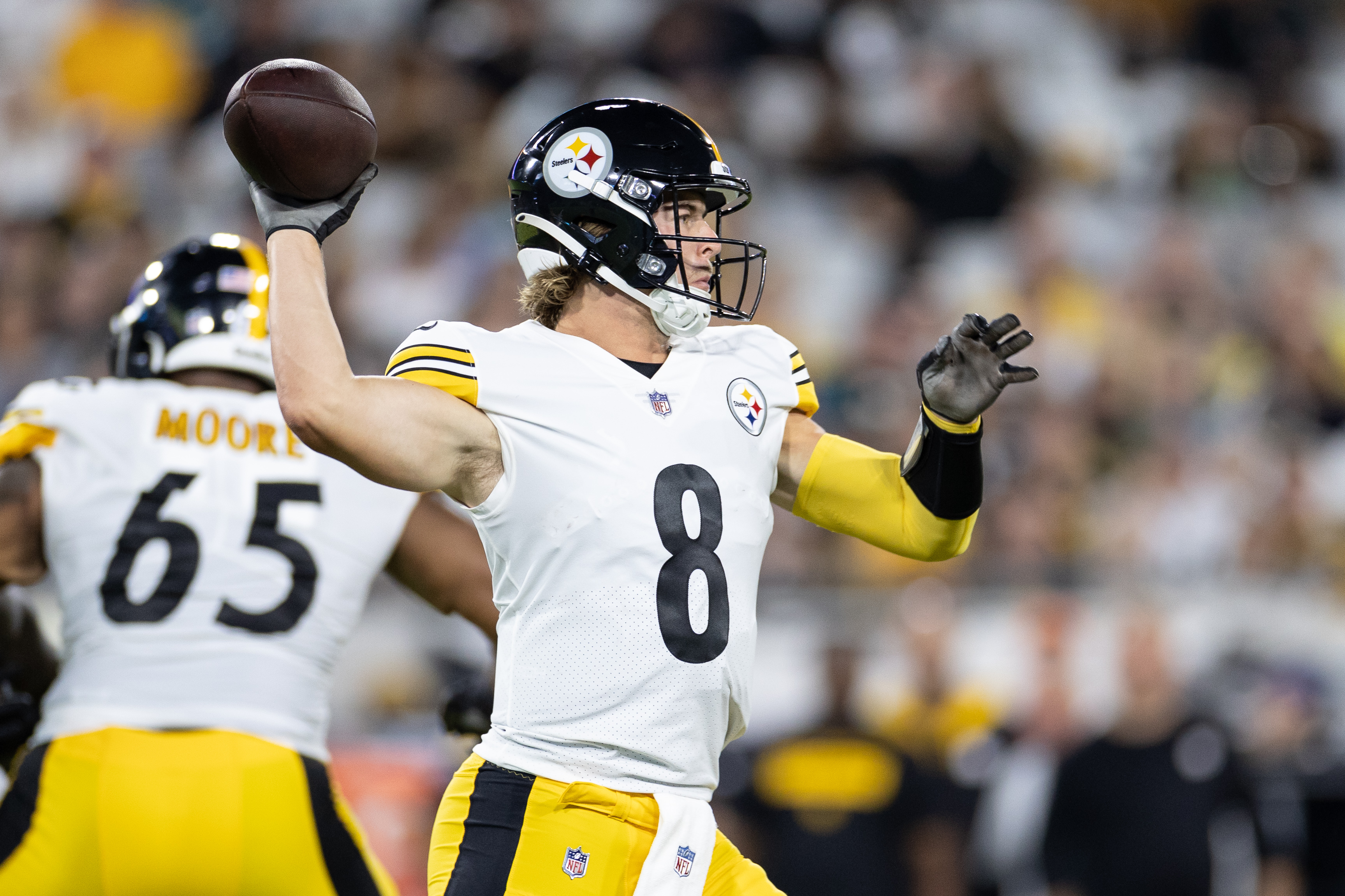 Kenny Pickett throws a pass from the pocket in a preseason Steelers game.