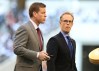 Joe Buck and Troy Aikman walking on a field together