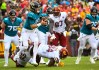 Sep 11, 2022; Landover, Maryland, USA; Jacksonville Jaguars quarterback Trevor Lawrence (16) is sacked by Washington Commanders linebacker Jamin Davis (52) during the first half at FedExField.