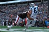 Sep 11, 2022; Charlotte, North Carolina, USA; Carolina Panthers quarterback Baker Mayfield (6) is hit by Cleveland Browns defensive tackle Taven Bryan (99) after releasing the ball in the second quarter at Bank of America Stadium.