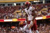 Sep 11, 2022; Landover, Maryland, USA; Washington Commanders wide receiver Jahan Dotson (1) celebrates with tight end John Bates (87) after catching the game winning touchdown against the Jacksonville Jaguars during the second half at FedExField.