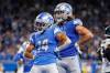 Sep 11, 2022; Detroit, Michigan, USA; Detroit Lions receiver Amon-Ra St. Brown (14) scores and celebrates a touchdown against the Philadelphia Eagles during the second half at Ford Field. Nfl Philadelphia Eagles At Detroit Lions