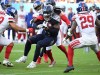Sep 11, 2022; Nashville, Tennessee, USA; Tennessee Titans running back Derrick Henry (22) is tackled after a short gain during the second half against the New York Giants at Nissan Stadium.