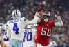 Sep 11, 2022; Arlington, Texas, USA; Dallas Cowboys quarterback Dak Prescott (4) hits his hand against Tampa Bay Buccaneers linebacker Shaquil Barrett (58) as he throws the ball during the fourth quarter at AT&T Stadium.