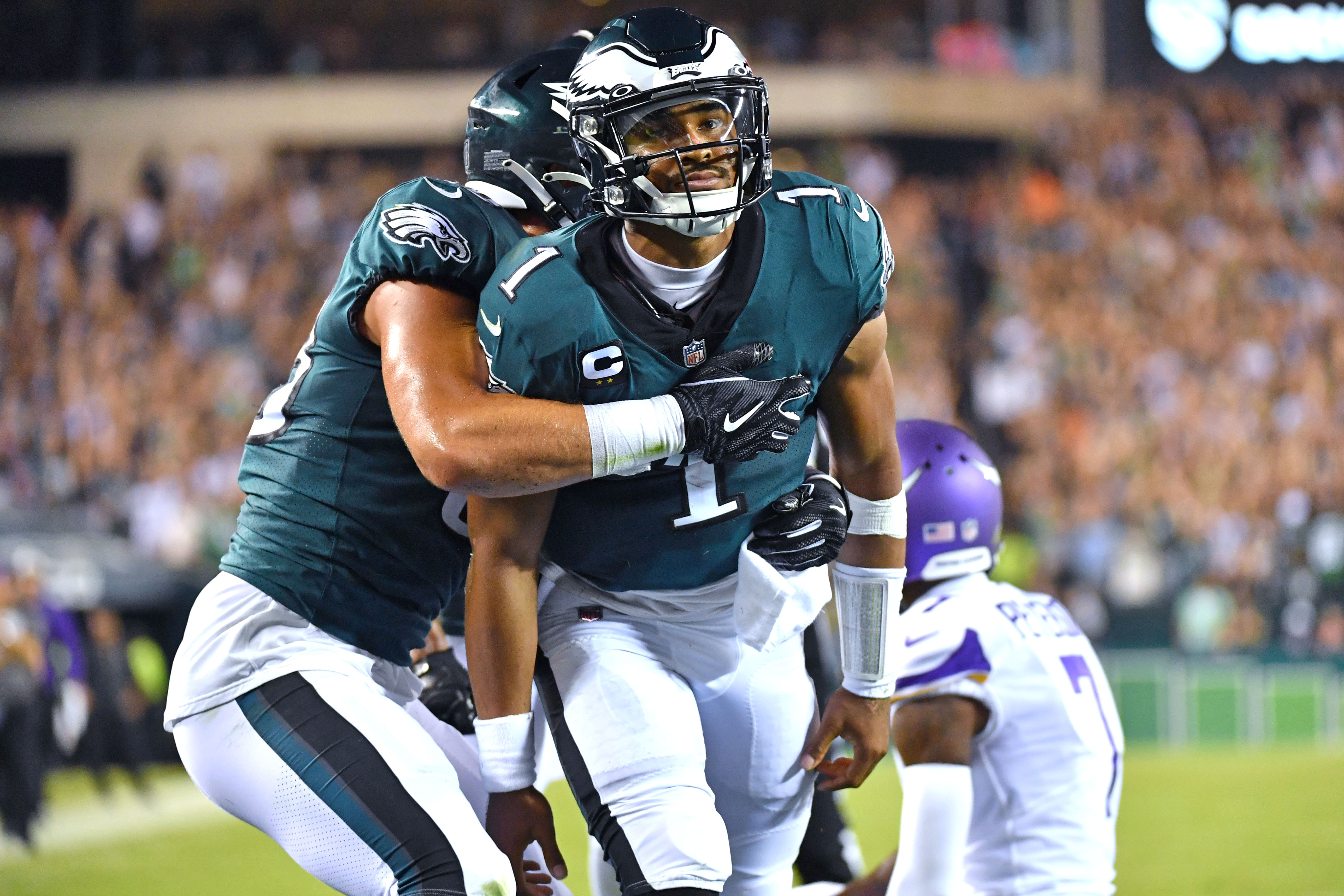Sep 19, 2022; Philadelphia, Pennsylvania, USA; Philadelphia Eagles quarterback Jalen Hurts (1) celebrates his 26-yard touchdown run with tight end Dallas Goedert (88) against the Minnesota Vikings during the second quarter at Lincoln Financial Field.