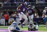 Sep 25, 2022; Minneapolis, Minnesota, USA; Minnesota Vikings running back Alexander Mattison (2) scores a touchdown over Detroit Lions linebacker Austin Bryant (2) and safety Will Harris (25) during the fourth quarter at U.S. Bank Stadium. 