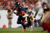 Sep 25, 2022; Denver, Colorado, USA; Denver Broncos quarterback Russell Wilson (3) is tackled by San Francisco 49ers defensive end Charles Omenihu (94) in the second quarter at Empower Field at Mile High. 