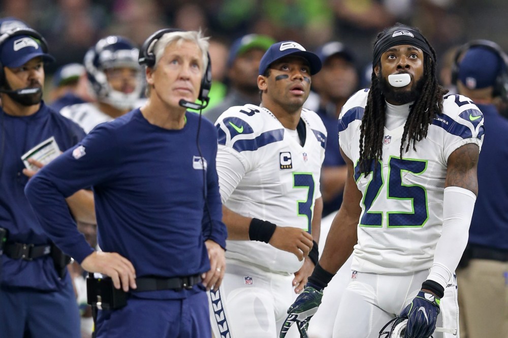 Oct 30, 2016; New Orleans, LA, USA; Seattle Seahawks head coach Pete Carroll and quarterback Russell Wilson (3) and cornerback Richard Sherman (25) watch from the sidelines in the second quarter against the New Orleans Saints at the Mercedes-Benz Superdome.