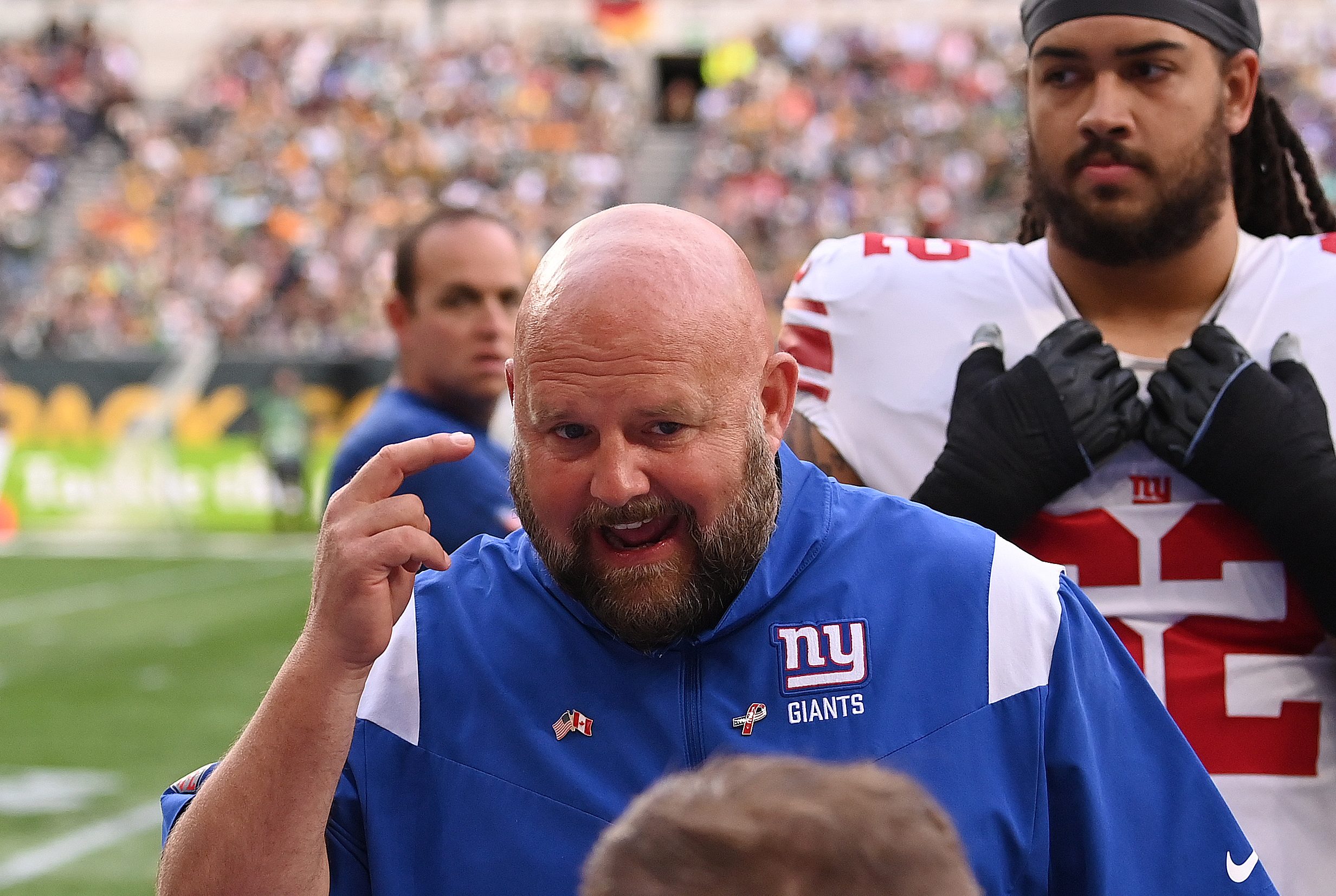 LONDON, ENGLAND - OCTOBER 09: Brian Daboll, Head Coach of the New York Giants gives their team instructions in the second half during the NFL match between New York Giants and Green Bay Packers at Tottenham Hotspur Stadium on October 09, 2022 in London, England.
