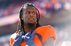 Jerry Jeudy with a stern face on the sideline while playing for the Broncos.