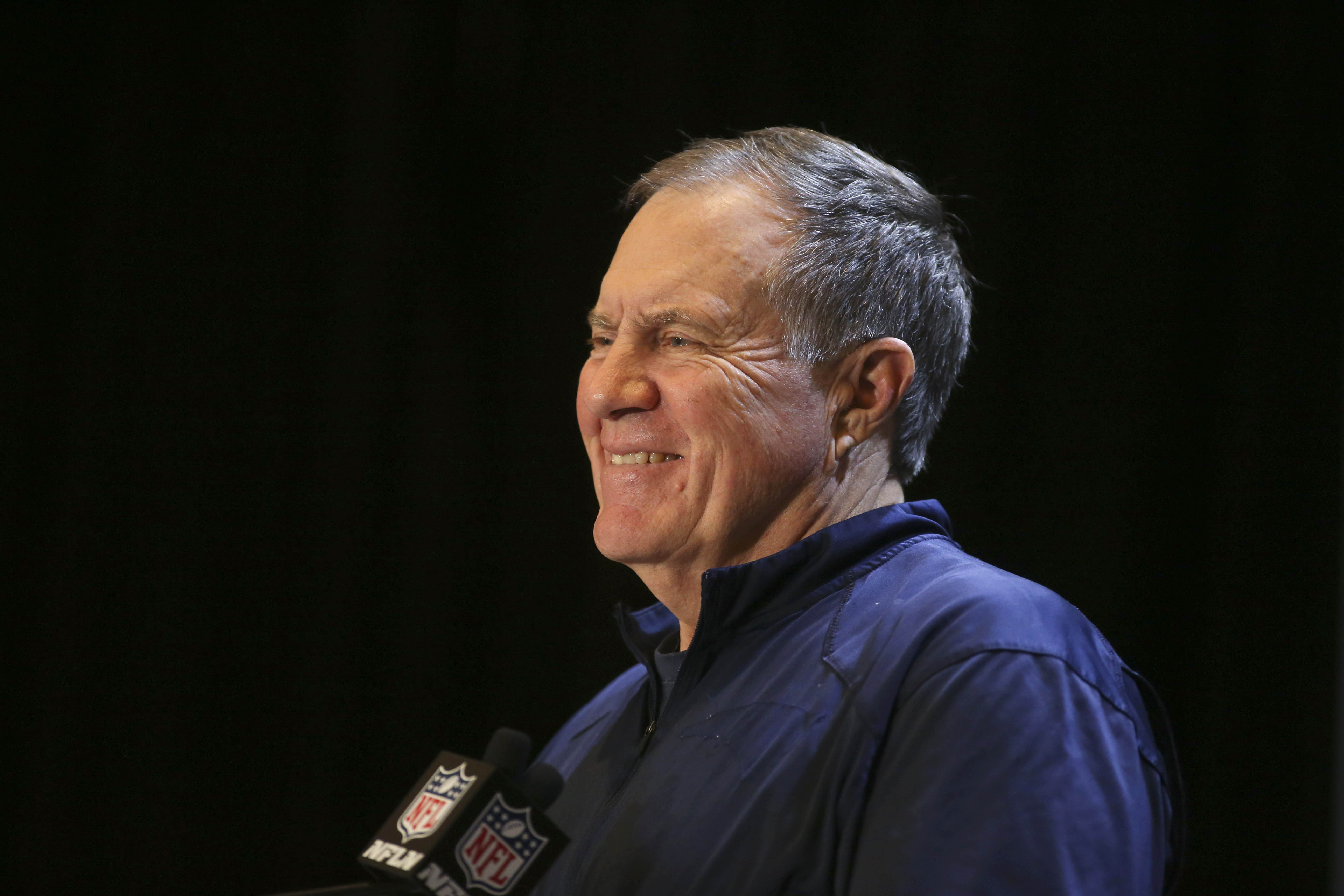 Bill Belichick smiles as he ... wait hold on that can't be right