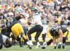 Oct 2, 2022; Pittsburgh, Pennsylvania, USA; New York Jets quarterback Zach Wilson (2) is pressured by Pittsburgh Steelers defensive tackle Cameron Heyward (97) and Alex Highsmith (56) during the second quarter at Acrisure Stadium.