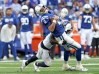 Oct 2, 2022; Indianapolis, Indiana, USA; Tennessee Titans cornerback Roger McCreary (21) tackles Indianapolis Colts quarterback Matt Ryan (2) during the first half at Lucas Oil Stadium. 