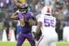 Oct 2, 2022; Baltimore, Maryland, USA; Baltimore Ravens quarterback Lamar Jackson (8) looks to pass against Buffalo Bills defensive end Boogie Basham (55) in the third quarter at M&T Bank Stadium.