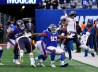 Oct 2, 2022; East Rutherford, New Jersey, USA; Chicago Bears quarterback Justin Fields (1) scrambles and throws the ball against the New York Giants during the second half at MetLife Stadium. 
