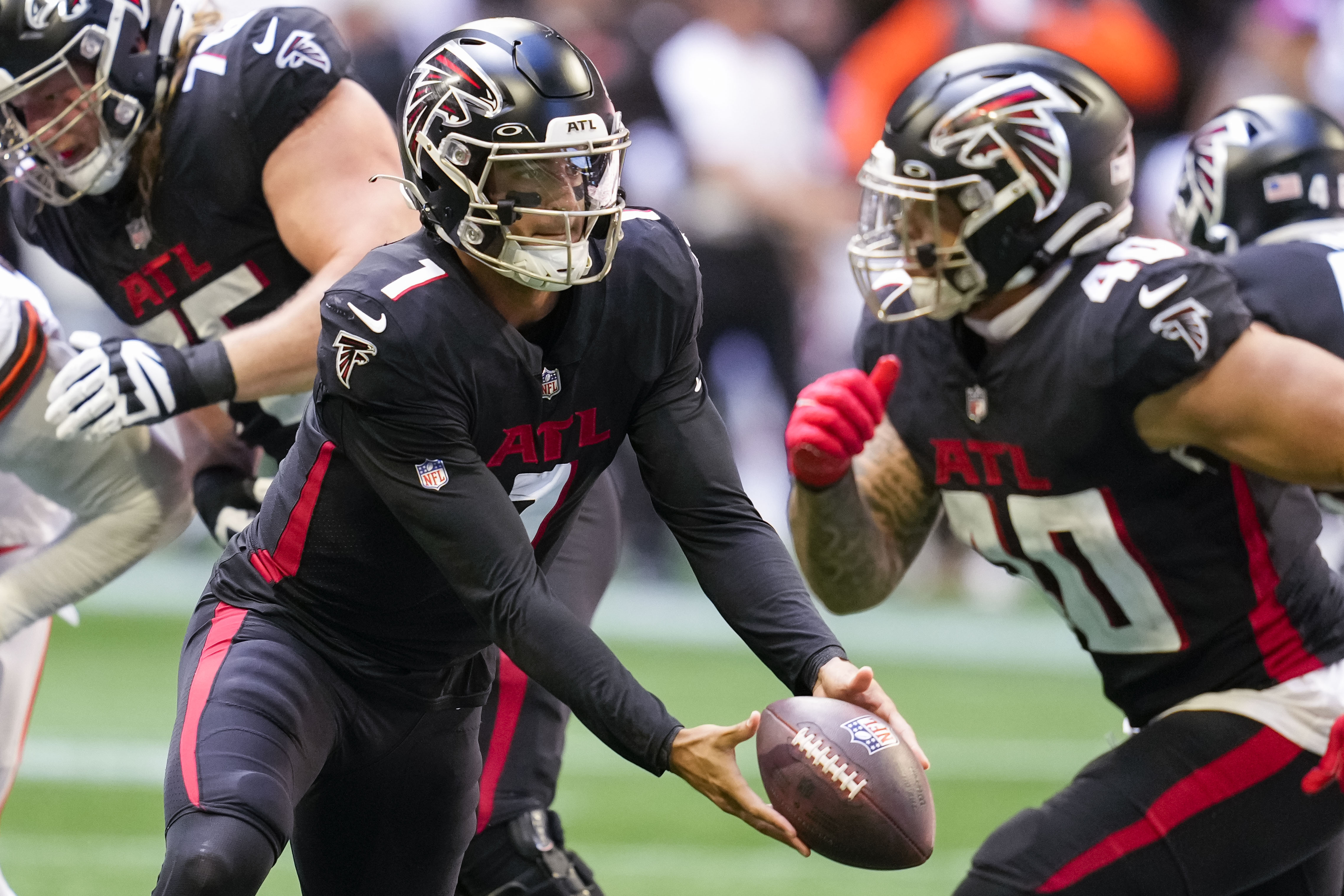 Oct 2, 2022; Atlanta, Georgia, USA; Atlanta Falcons quarterback Marcus Mariota (1) pitches the ball against the Cleveland Browns during the second half at Mercedes-Benz Stadium.
