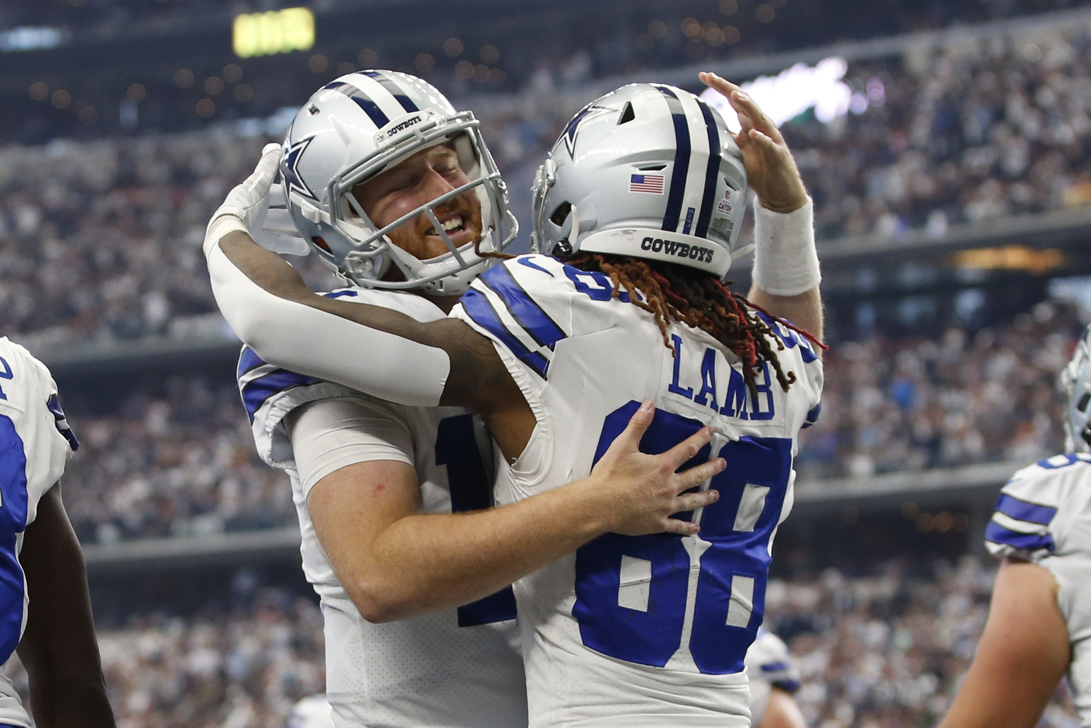 Oct 2, 2022; Arlington, Texas, USA; Dallas Cowboys quarterback Cooper Rush (10) and wide receiver CeeDee Lamb (88) celebrates a touchdown against the Washington Commanders in the fourth quarter