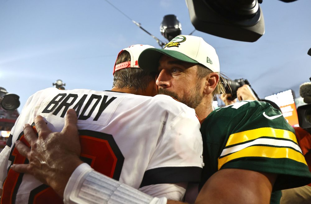 Sep 25, 2022; Tampa, Florida, USA; Tampa Bay Buccaneers quarterback Tom Brady (12) and Green Bay Packers quarterback Aaron Rodgers (12) greet after the game at Raymond James Stadium.