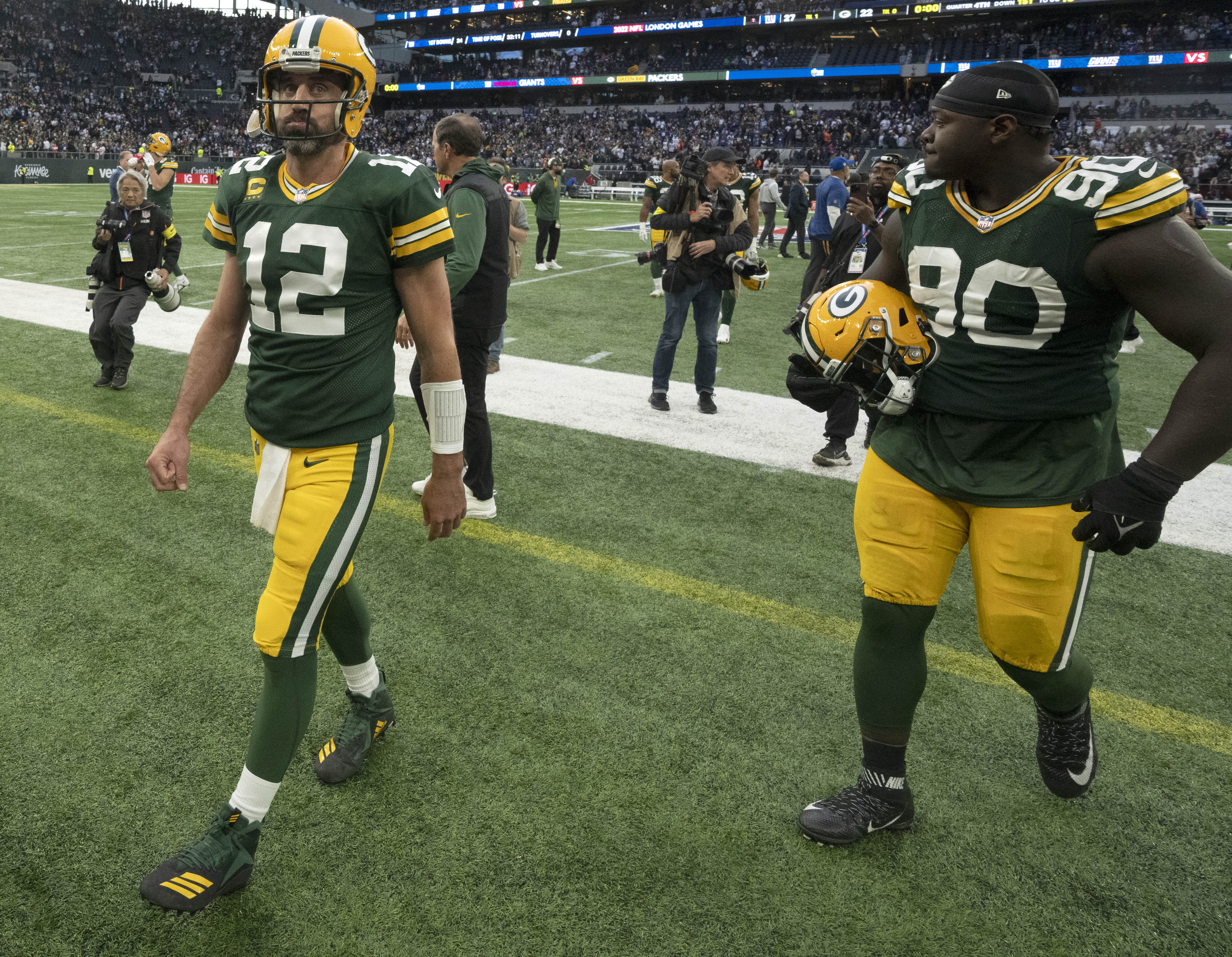 Oct 9, 2022; Tottenham, ENG; Green Bay Packers quarterback Aaron Rodgers (12) leave the field after their game at Tottenham Hotspur Stadium. The New York Giants beat the Green Bay Packers 27-22.