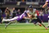 Oct 9, 2022; Minneapolis, Minnesota, USA; Chicago Bears quarterback Justin Fields (1) dives for a first down against the Minnesota Vikings linebacker Eric Kendricks (54) in the third quarter at U.S. Bank Stadium.