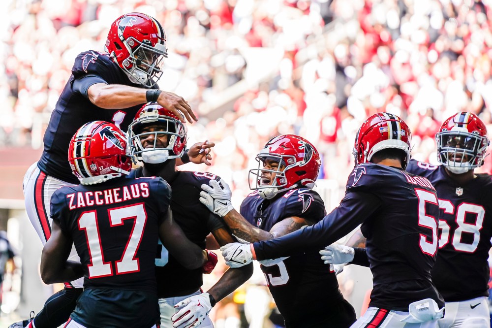 Oct 16, 2022; Atlanta, Georgia, USA; Atlanta Falcons players including quarterback Marcus Mariota (1) react with tight end Kyle Pitts (8) after his touchdown catch against the San Francisco 49ers during the second half at Mercedes-Benz Stadium.