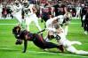 Oct 20, 2022; Glendale, Arizona, USA; Arizona Cardinals wide receiver Greg Dortch (83) dives into the end zone for a touchdown past New Orleans Saints safety Justin Evans (30) in the second half at State Farm Stadium.