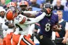 Oct 23, 2022; Baltimore, Maryland, USA; Baltimore Ravens quarterback Lamar Jackson (8) stiff arms Cleveland Browns linebacker Deion Jones (54) during the fourth quarter at M&T Bank Stadium.