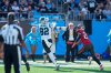 Oct 23, 2022; Charlotte, North Carolina, USA; Carolina Panthers tight end Tommy Tremble (82) makes a touchdown catch while chased by Tampa Bay Buccaneers cornerback Zyon McCollum (27) during the second half at Bank of America Stadium.