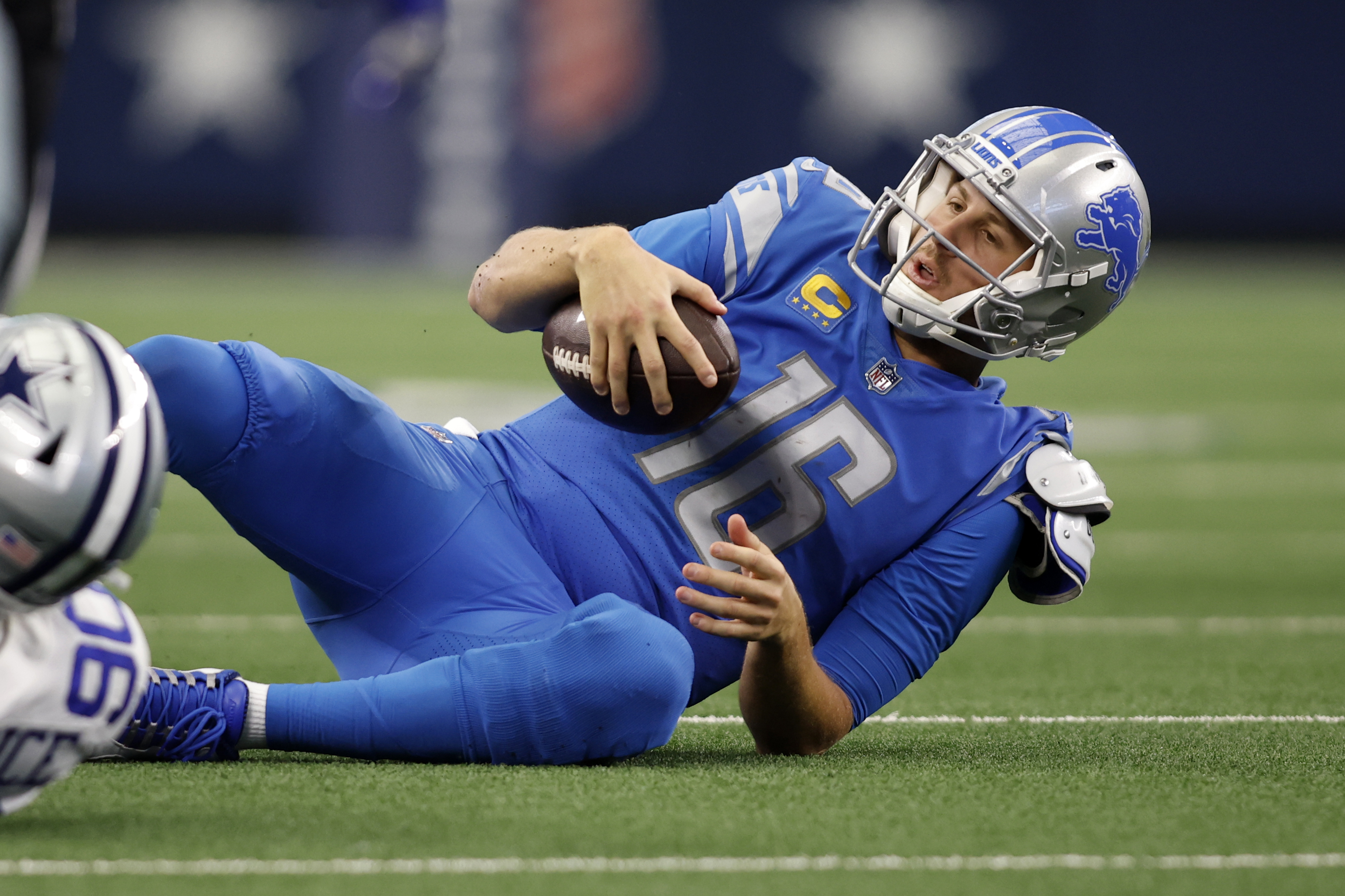 Oct 23, 2022; Arlington, Texas, USA; Detroit Lions quarterback Jared Goff (16) is tackled by Dallas Cowboys defensive end DeMarcus Lawrence (90) in the third quarter at AT&T Stadium.