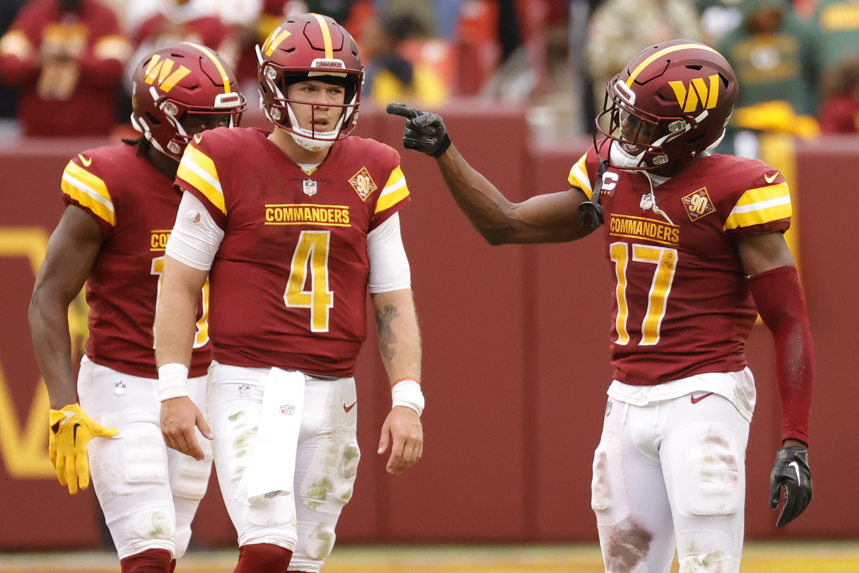 Oct 23, 2022; Landover, Maryland, USA; Washington Commanders wide receiver Terry McLaurin (17) celebrates as Commanders quarterback Taylor Heinicke (4) looks on after connecting on a third down convewriosn against the Green Bay Packers /during the final minutes of the fourth quarter at FedExField. 