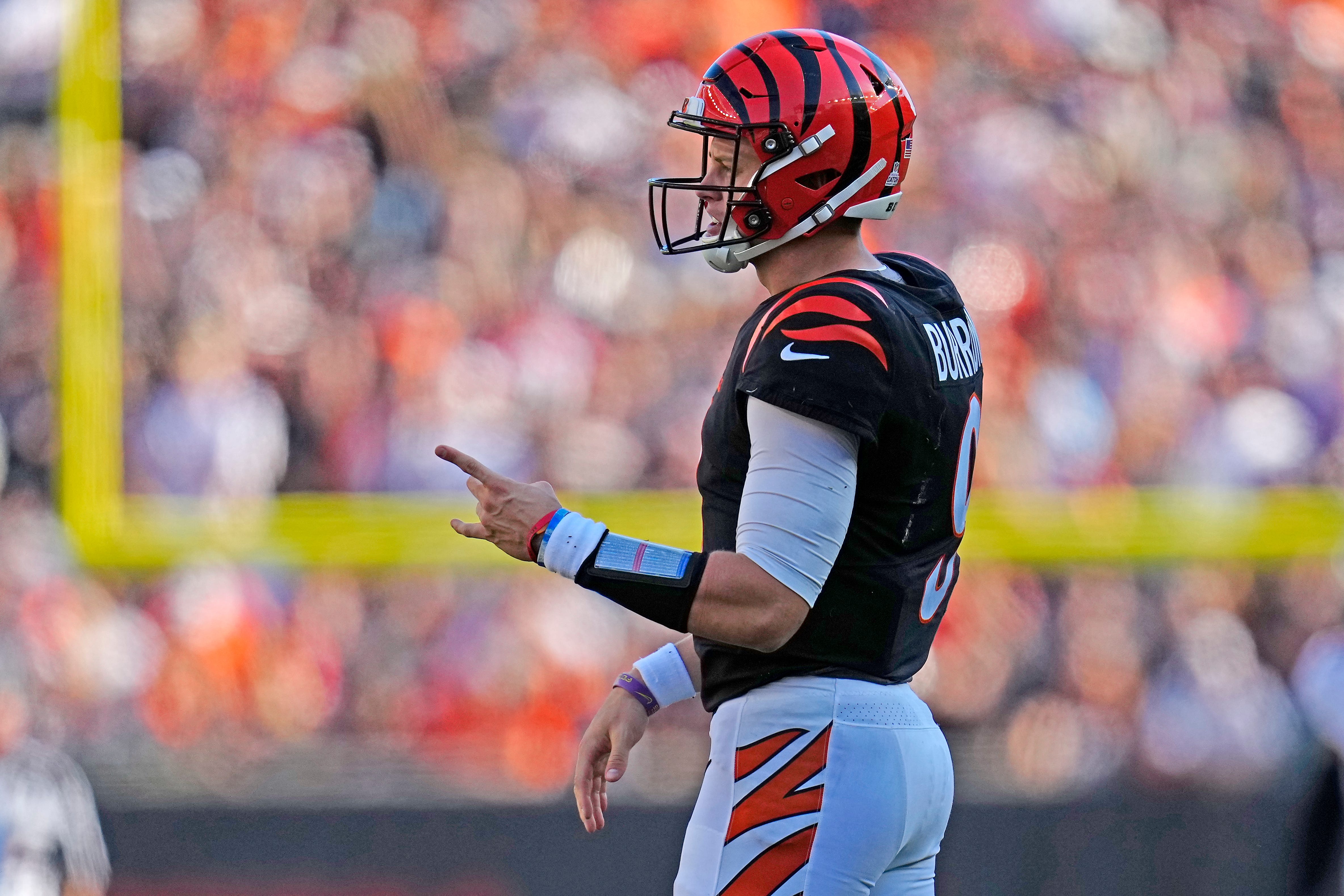 Cincinnati Bengals quarterback Joe Burrow (9) shares words with center Ted Karras (64) Ofer being sacked in the third quarter of the NFL Week 7 game between the Cincinnati Bengals and the Atlanta Falcons at Paycor Stadium in downtown Cincinnati on Sunday, Oct. 23, 2022. The Bengals won 35-17.