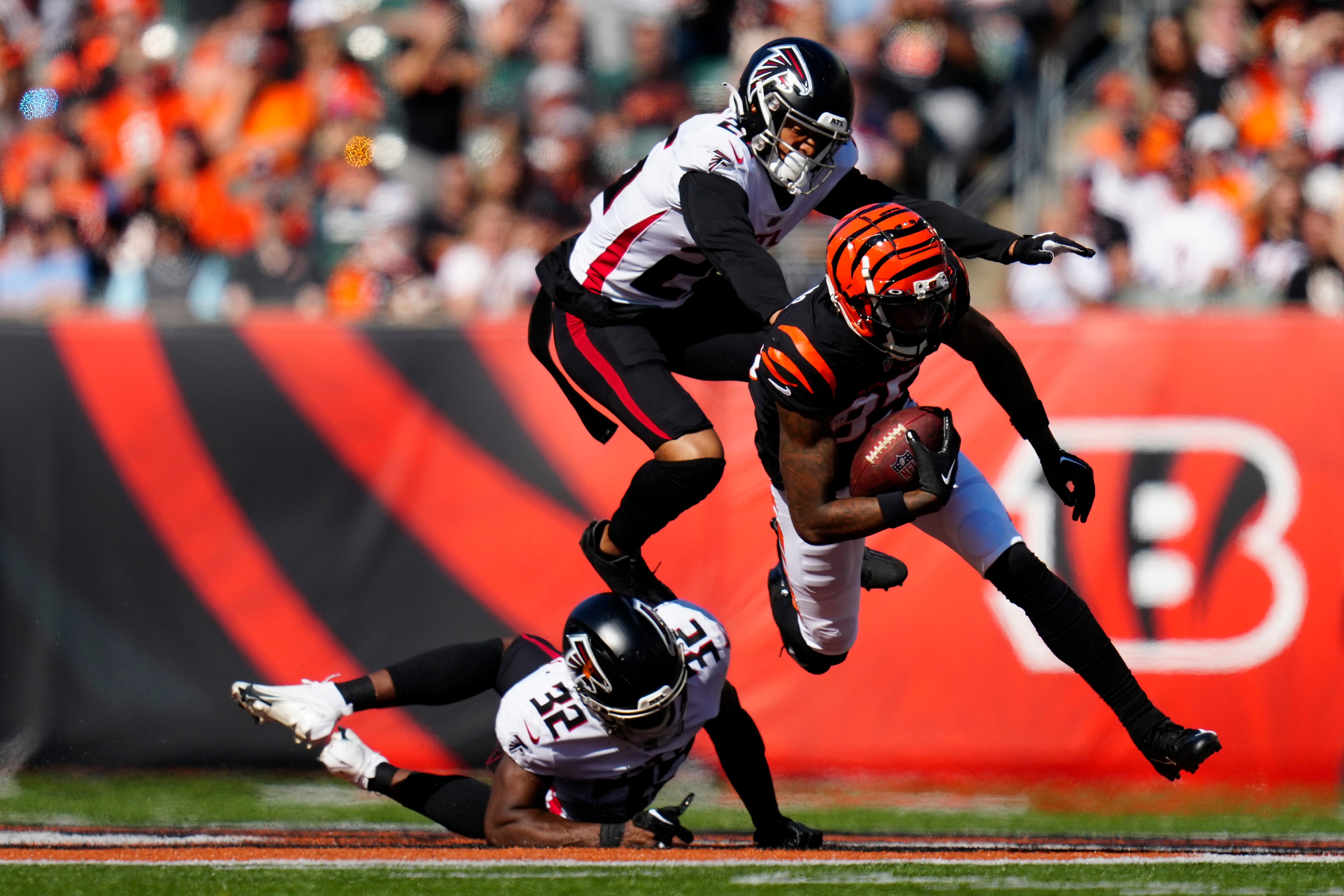 Cincinnati Bengals wide receiver Tee Higgins (85) comes down with a catch ahead of Atlanta Falcons cornerback Isaiah Oliver (26) in the second quarter of the NFL Week 7 game between the Cincinnati Bengals and the Atlanta Falcons at Paycor Stadium in downtown Cincinnati on Sunday, Oct. 23, 2022.
