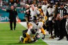 Oct 23, 2022; Miami Gardens, Florida, USA; Miami Dolphins linebacker Jaelan Phillips (15) tackles Pittsburgh Steelers quarterback Kenny Pickett (8) during the second half at Hard Rock Stadium. 