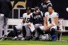 Oct 30, 2022; New Orleans, Louisiana, USA; Las Vegas Raiders quarterback Derek Carr (4) and Las Vegas Raiders wide receiver DJ Turner (19) sit on the bench against the New Orleans Saints during the first half at Caesars Superdome. 