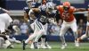 Tony Pollard runs with the ball during a 2022 game against the Bears. 