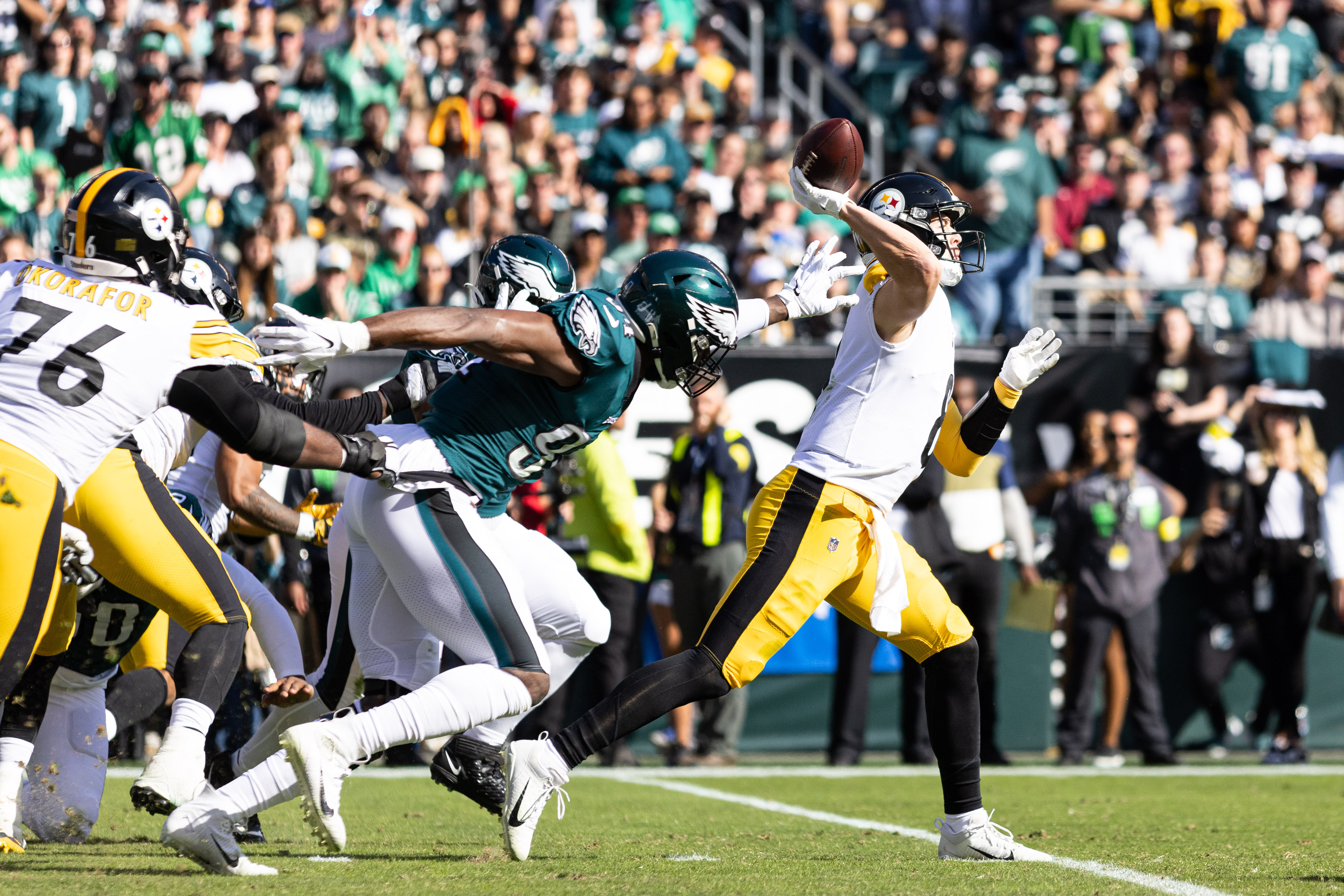 Oct 30, 2022; Philadelphia, Pennsylvania, USA; Pittsburgh Steelers quarterback Kenny Pickett (8) passes the ball in front of Philadelphia Eagles defensive end Josh Sweat (94) during the second quarter at Lincoln Financial Field. 