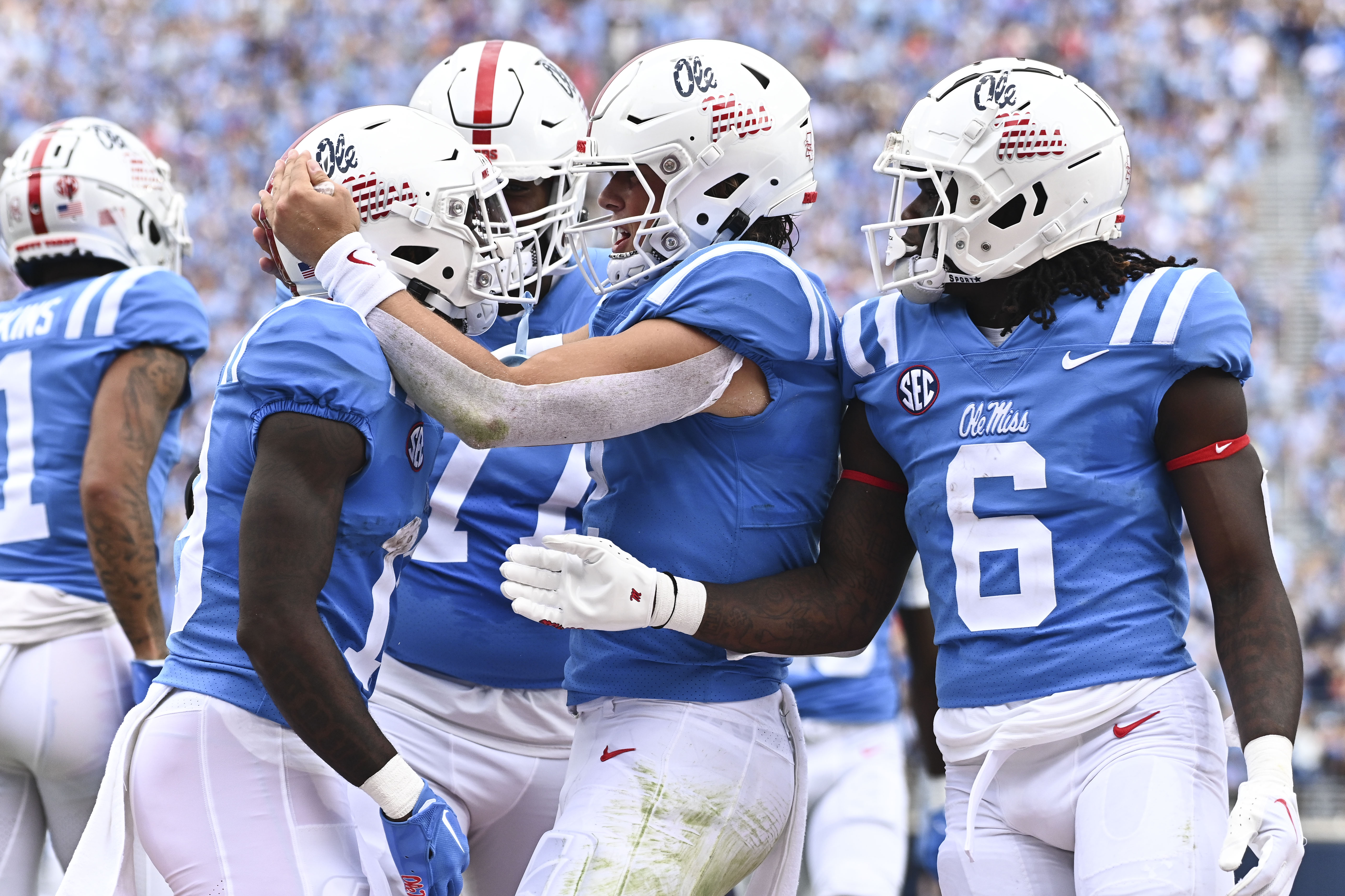 Football players celebrate on field