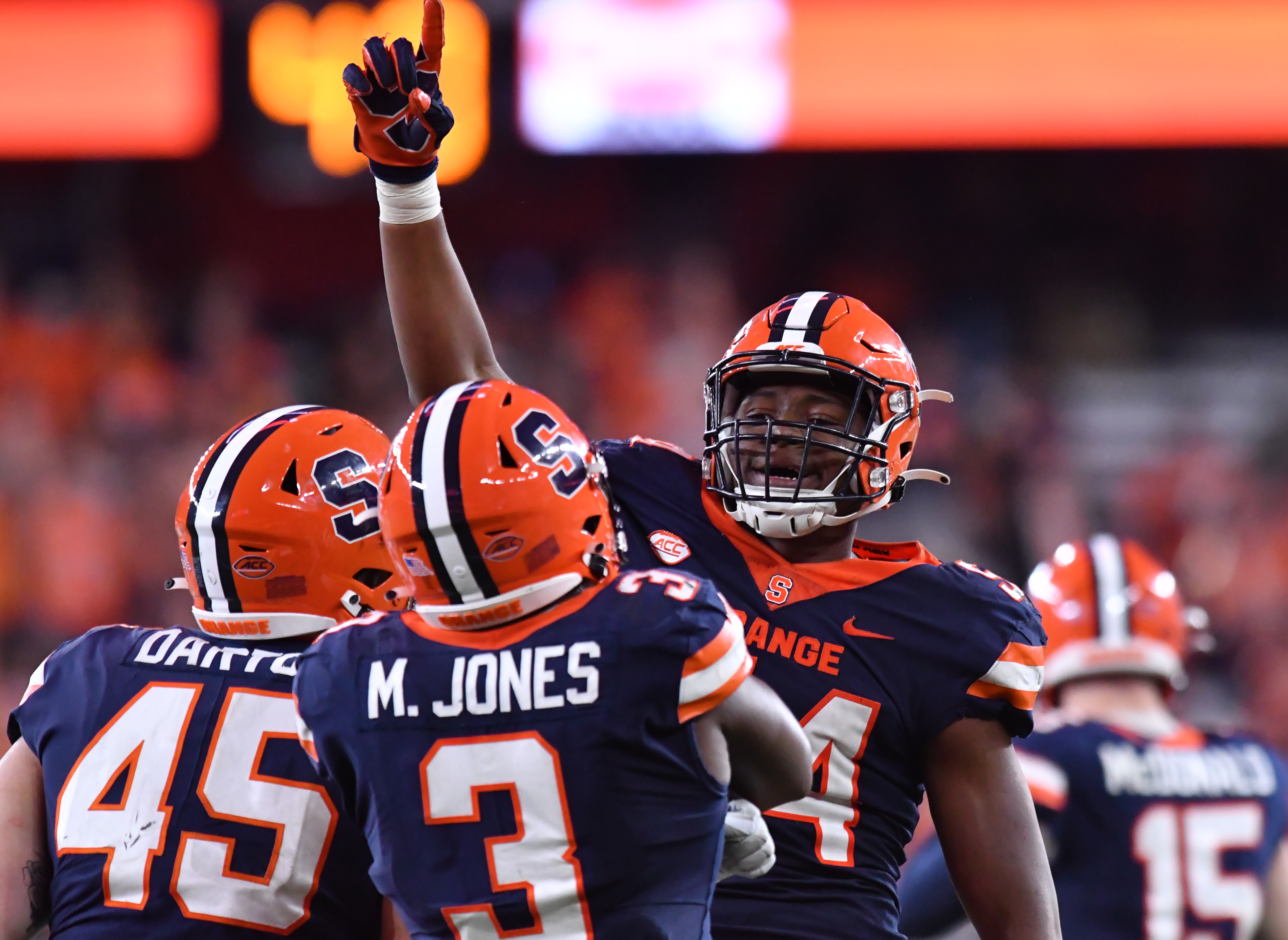 Syracuse Orange defensive lineman Jatius Geer holds up index finger during game