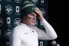 New York Jets quarterback Zach Wilson talks with reporters following a 10-3 loss to the New England Patriots following an NFL football game, Sunday, Nov. 20, 2022, in Foxborough, Mass.