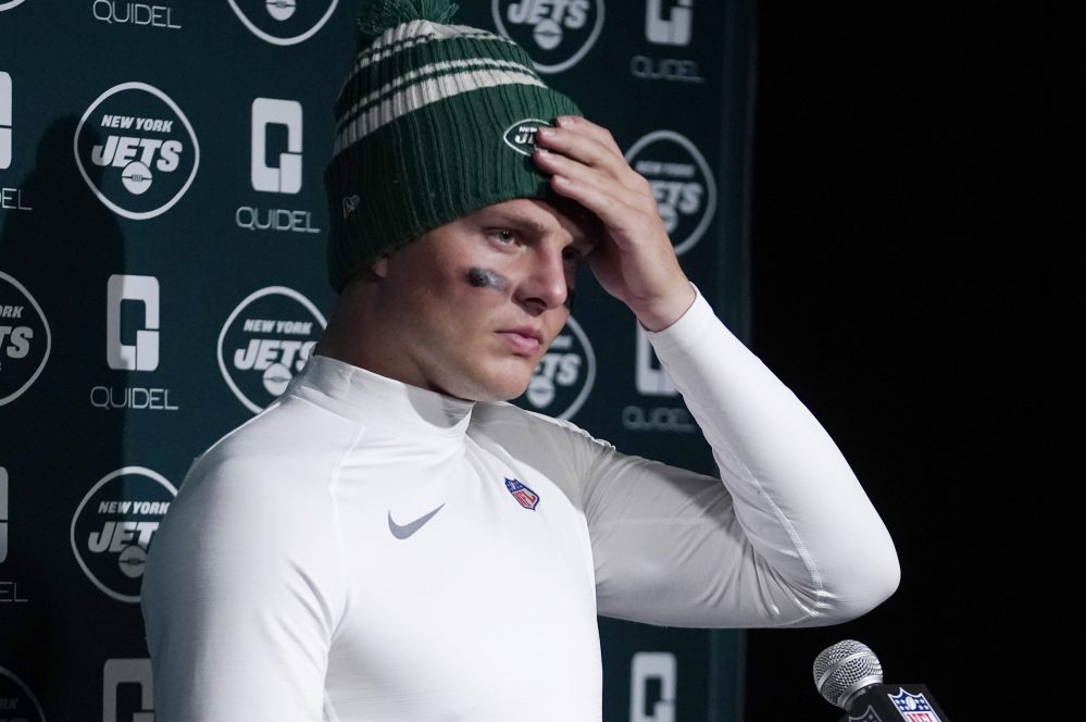 New York Jets quarterback Zach Wilson talks with reporters following a 10-3 loss to the New England Patriots following an NFL football game, Sunday, Nov. 20, 2022, in Foxborough, Mass.