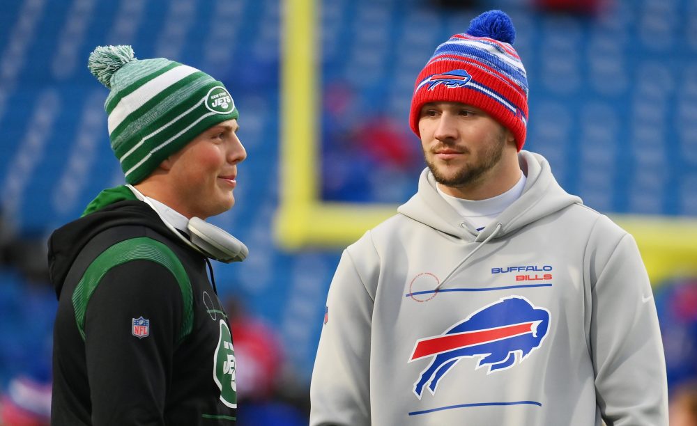 Jan 9, 2022; Orchard Park, New York, USA; New York Jets quarterback Zach Wilson (left) talks with Buffalo Bills quarterback Josh Allen (right) prior to the game at Highmark Stadium.