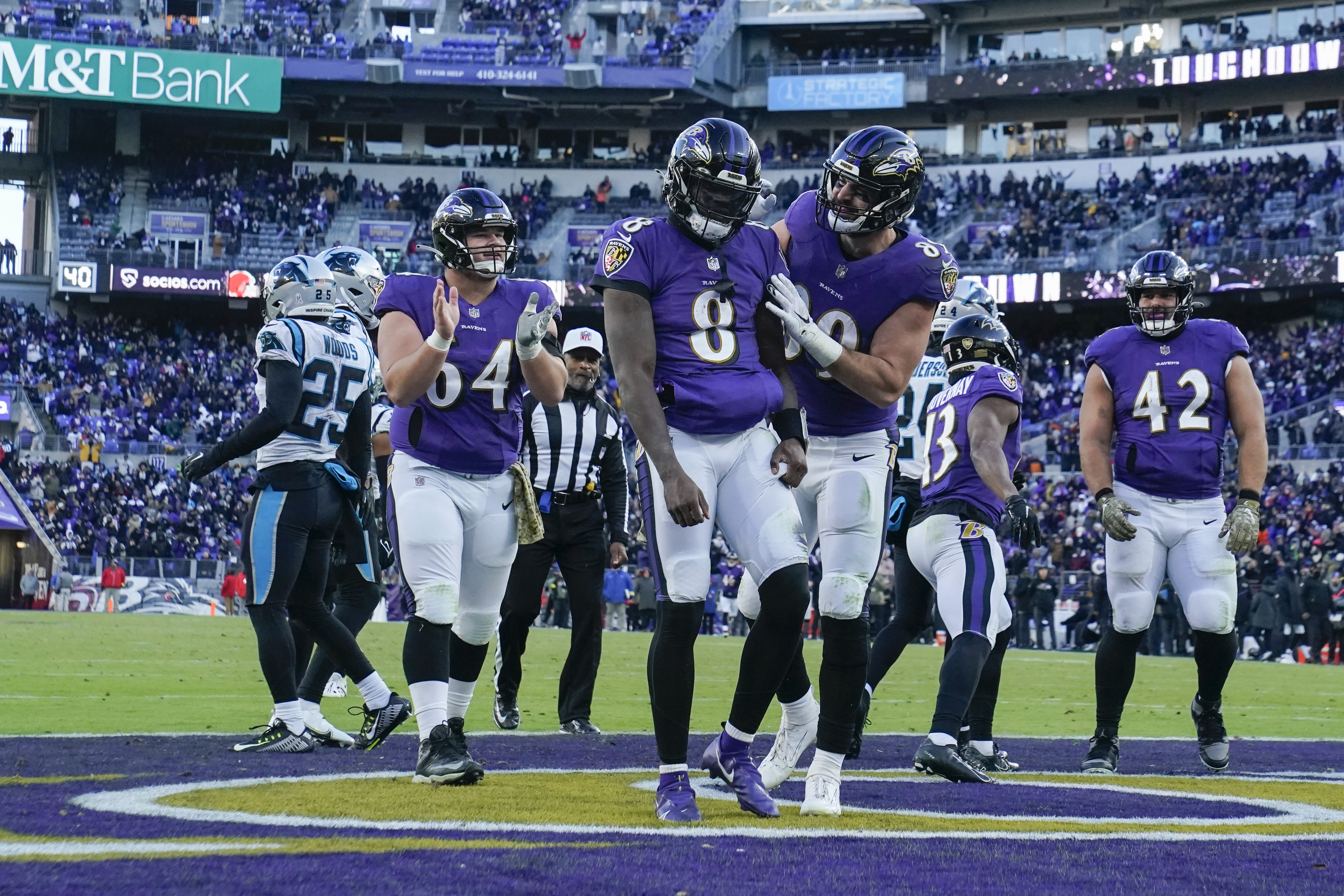 Nov 20, 2022; Baltimore, Maryland, USA; Baltimore Ravens quarterback Lamar Jackson (8) celebrates with tight end Mark Andrews (89) after running for a touchdown against the Carolina Panthers during the second half at M&T Bank Stadium. 