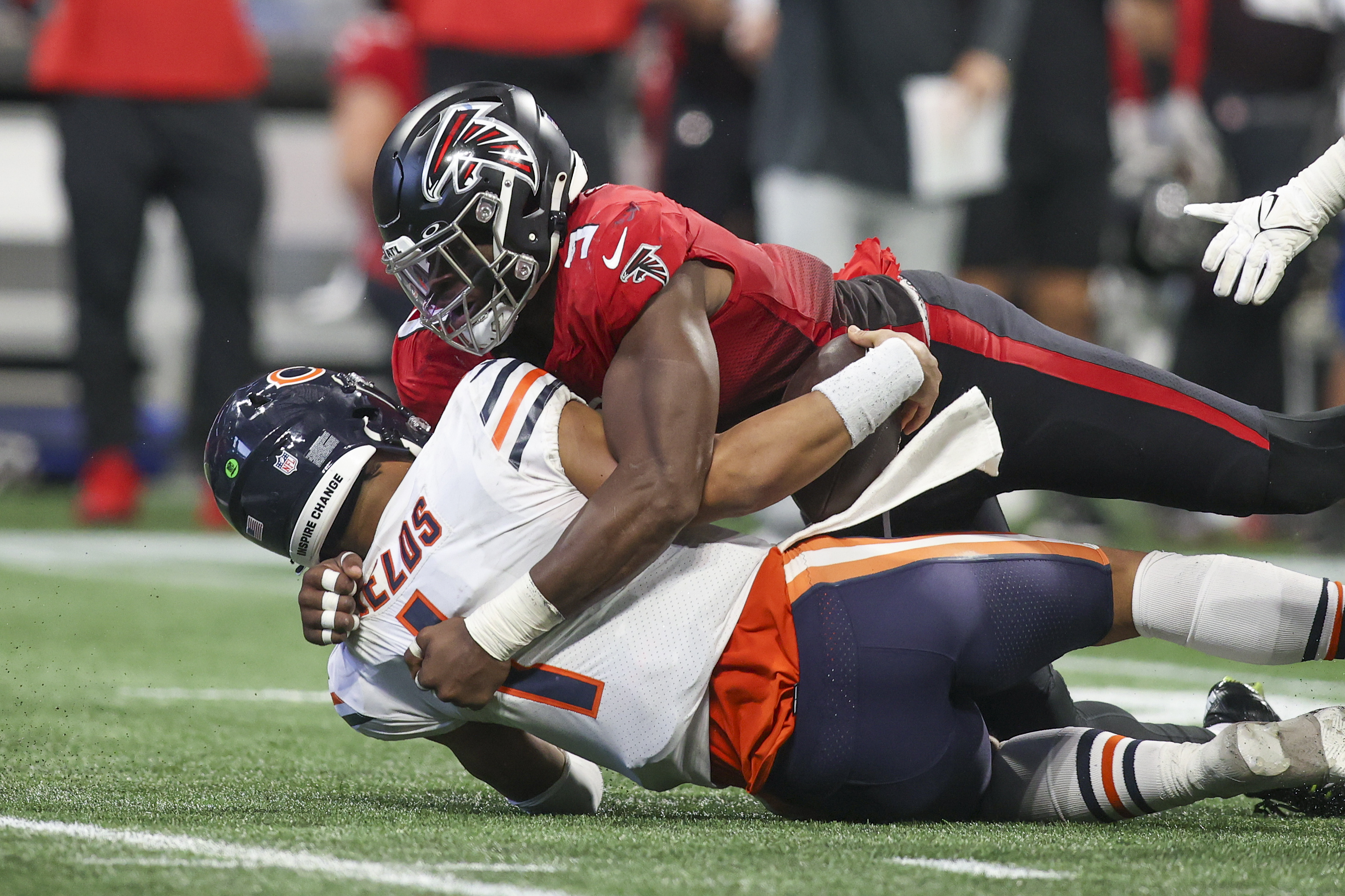 Nov 20, 2022; Atlanta, Georgia, USA; Atlanta Falcons linebacker Lorenzo Carter (9) hits Chicago Bears quarterback Justin Fields (1) in the second half at Mercedes-Benz Stadium. 